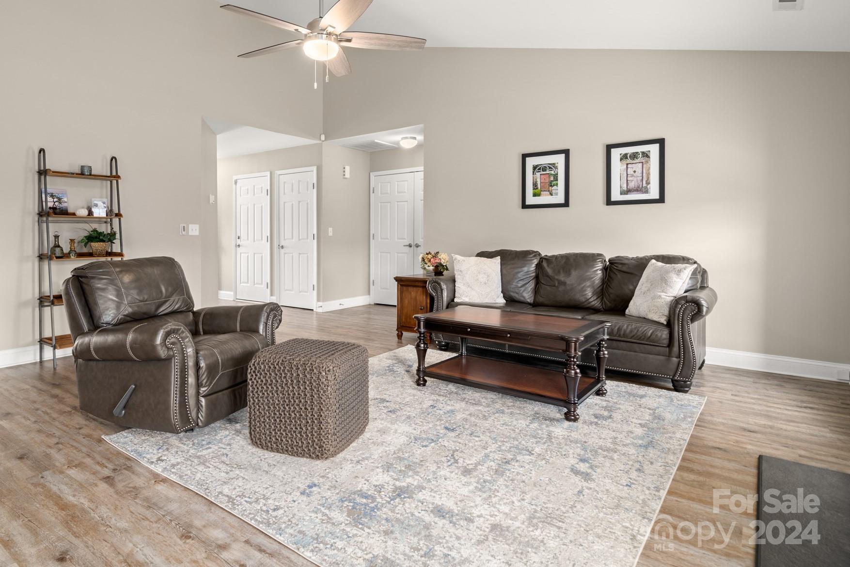 290 West Swift Creek Road Fletcher, NC 28732 - Photo 4 of 33 a living room with furniture and a chandelier