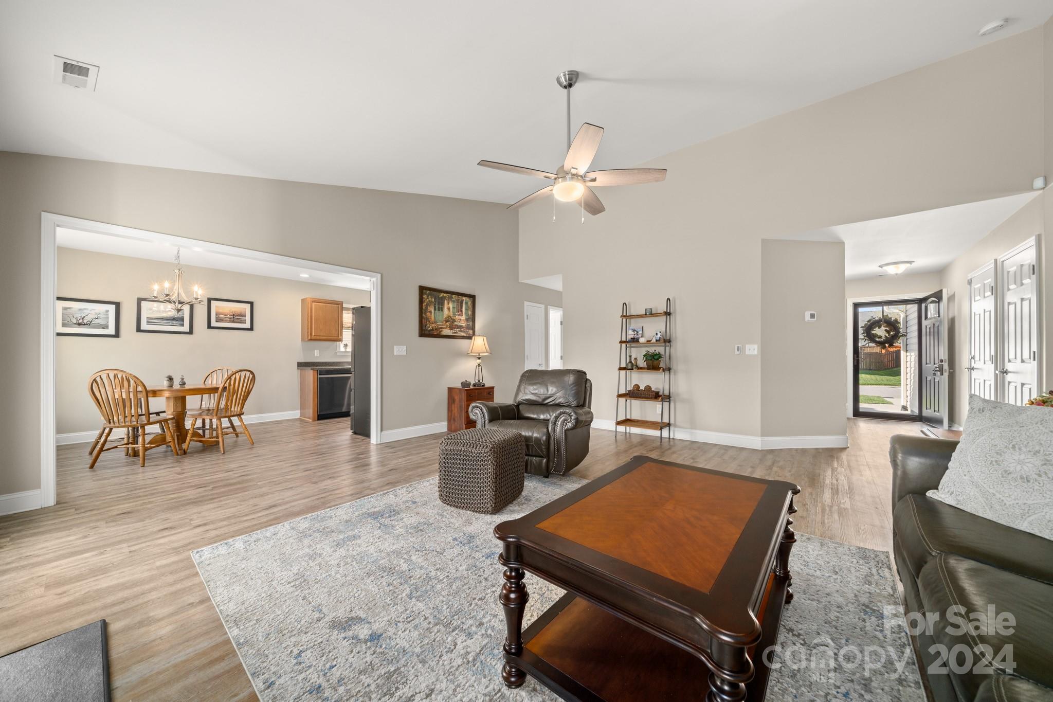 290 West Swift Creek Road Fletcher, NC 28732 - Photo 5 of 33 a living room with furniture a table and wooden floor