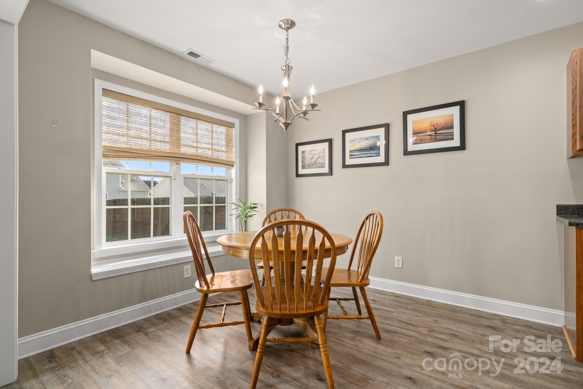 290 West Swift Creek Road Fletcher, NC 28732 - Photo 6 of 33 a view of a dining room with furniture window and wooden floor
