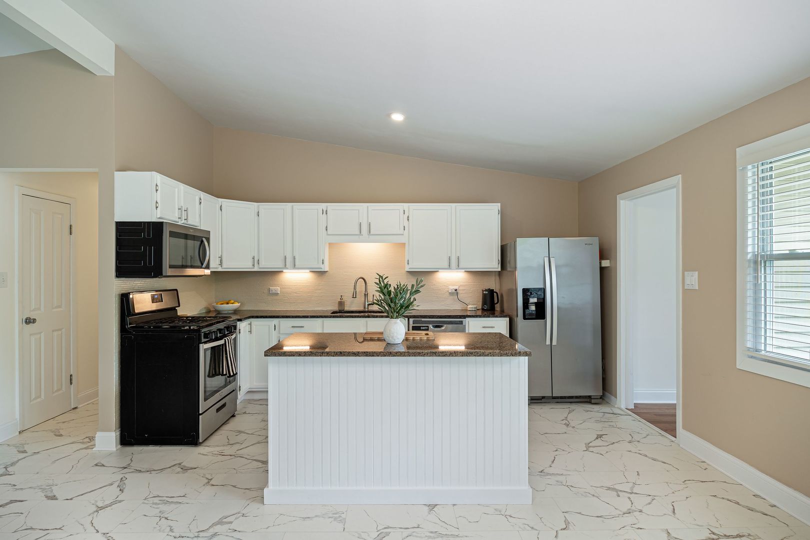 2117 Grouse Lane Rolling Meadows, IL 60008 - Photo 5 of 25 a kitchen with stainless steel appliances granite countertop a stove a refrigerator and a sink with granite countertops