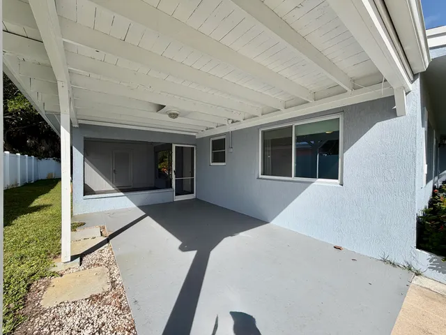 a balcony with view of the house