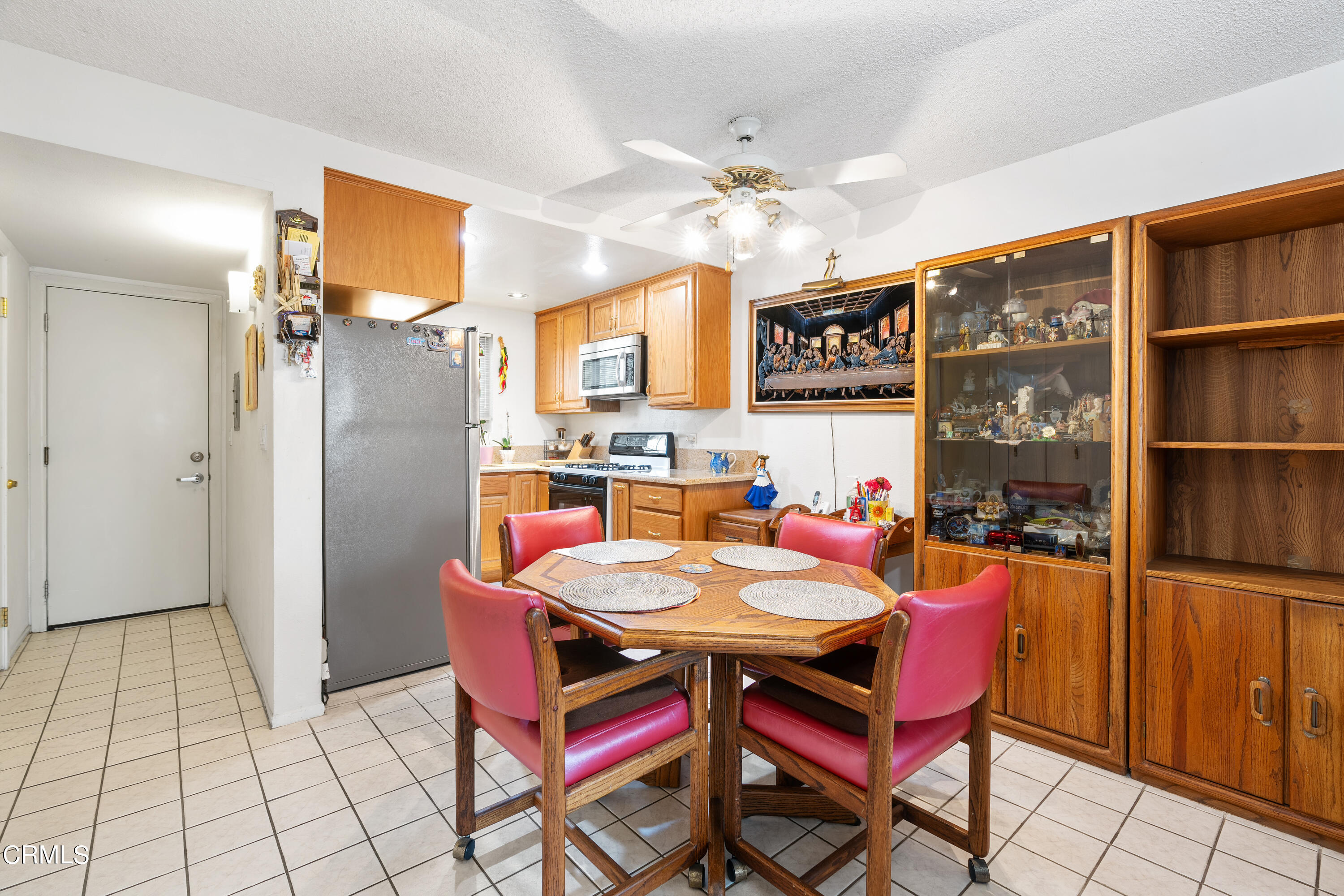 5170 North River Road, Unit C Oceanside, CA 92057 - Photo 11 of 43 a dining hall with a dining table and chairs with wooden floor