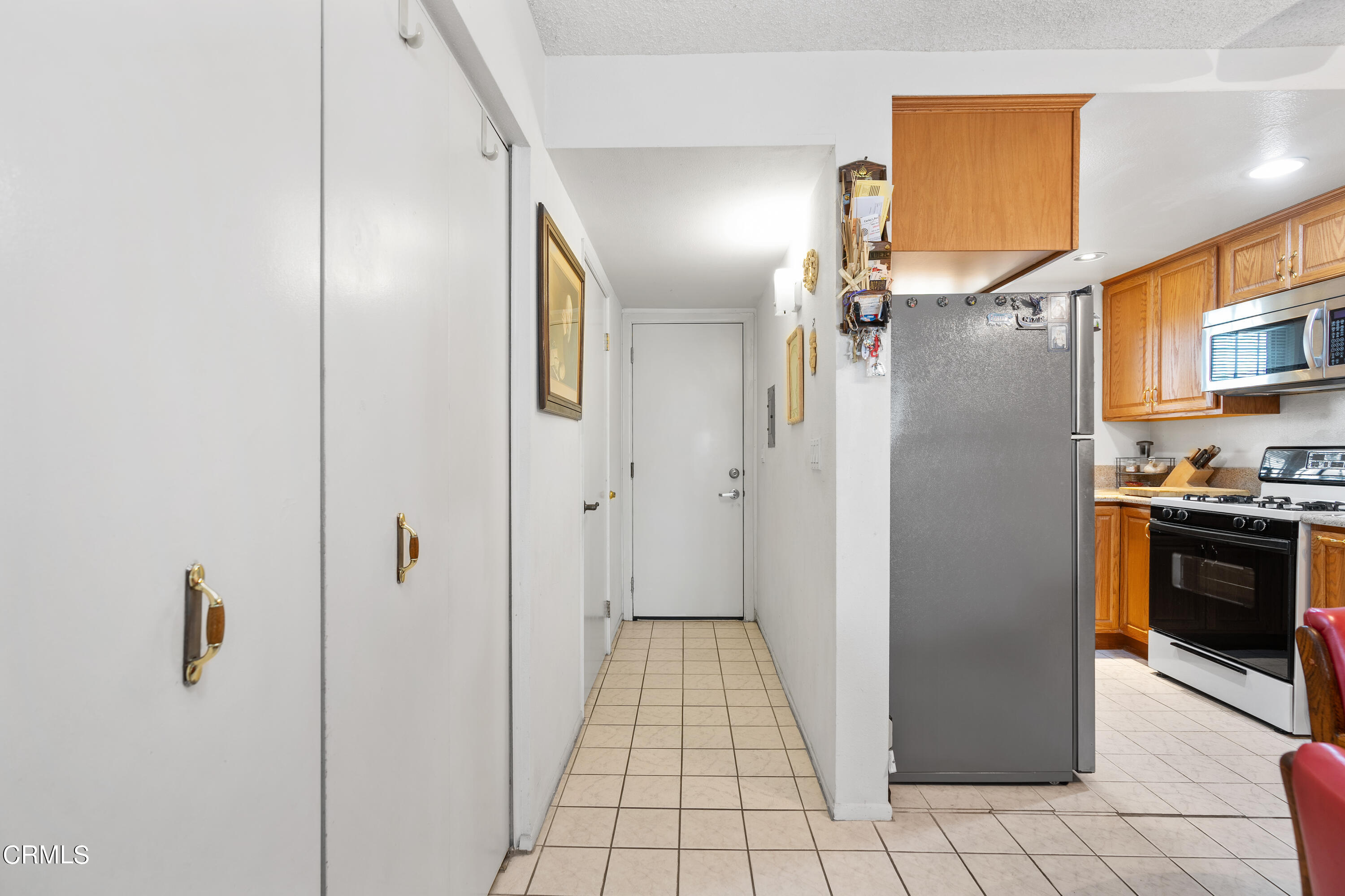 5170 North River Road, Unit C Oceanside, CA 92057 - Photo 16 of 43 a view of a kitchen from the hallway