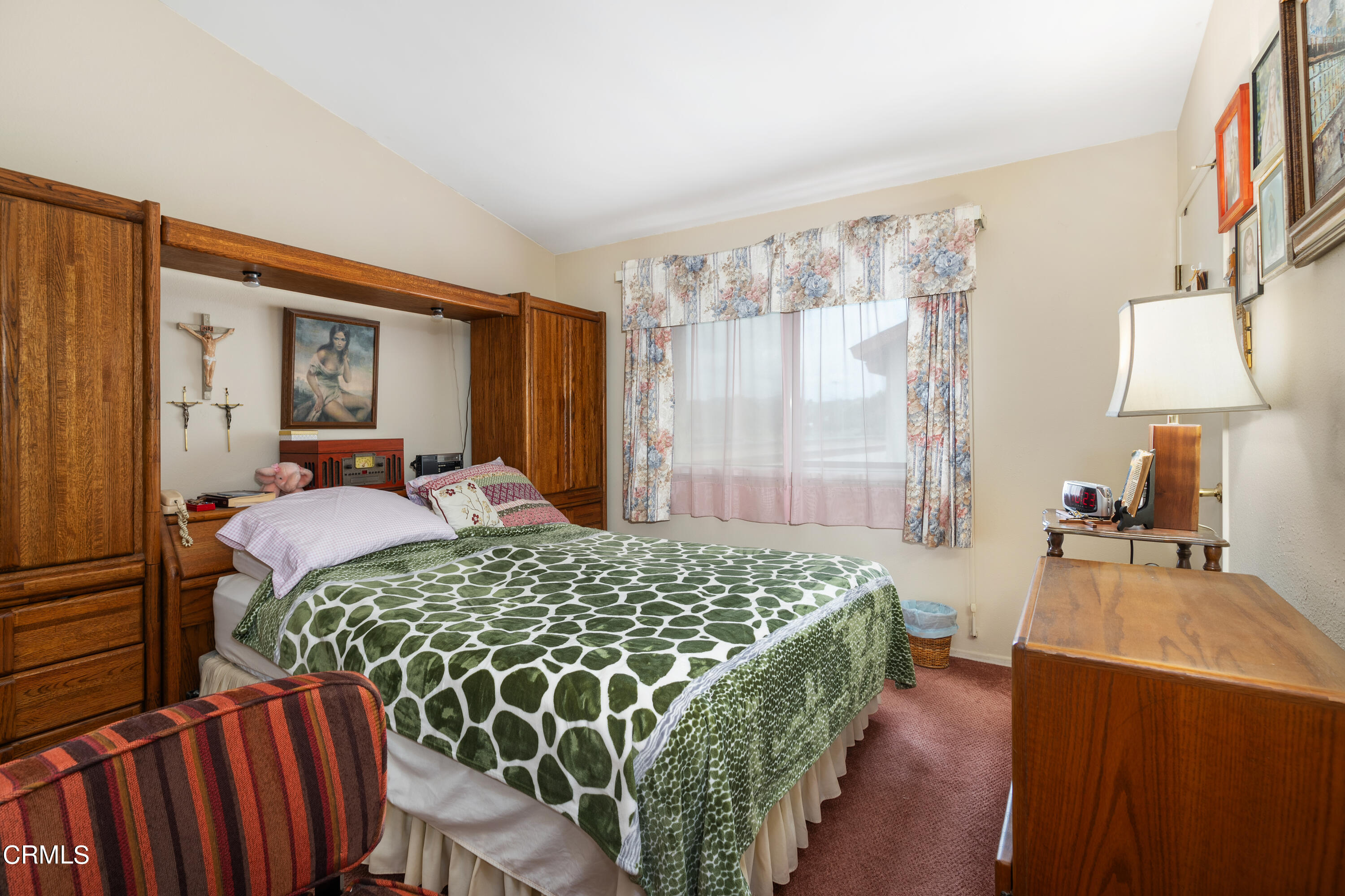 5170 North River Road, Unit C Oceanside, CA 92057 - Photo 20 of 43 a bedroom with a bed and a lamp