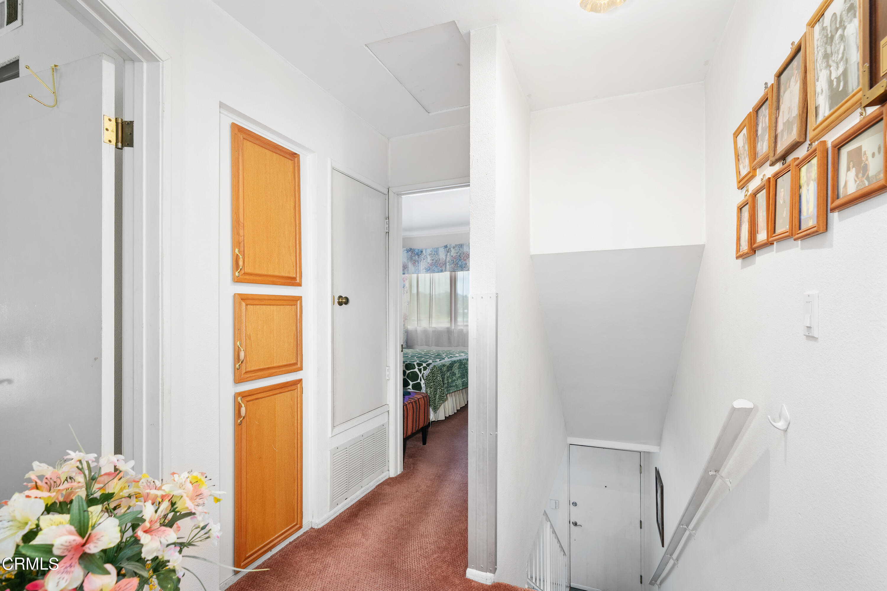 5170 North River Road, Unit C Oceanside, CA 92057 - Photo 26 of 43 a view of entryway with wooden floor and a potted plant