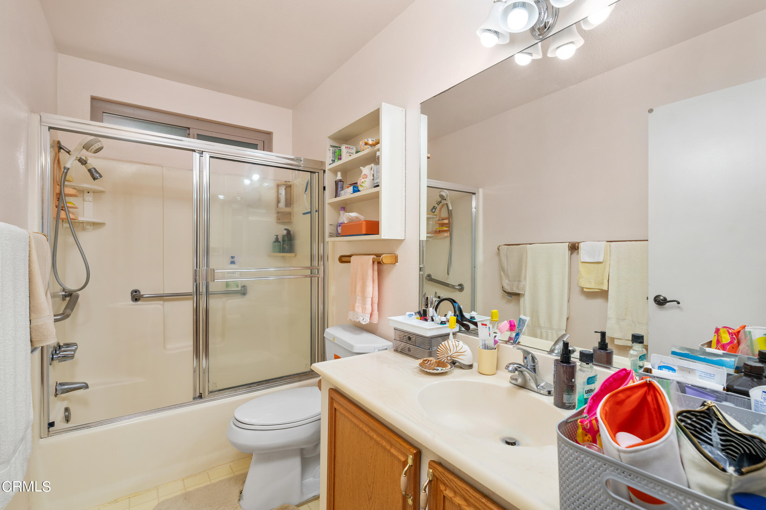 5170 North River Road, Unit C Oceanside, CA 92057 - Photo 28 of 43 a bathroom with a sink vanity mirror and toilet
