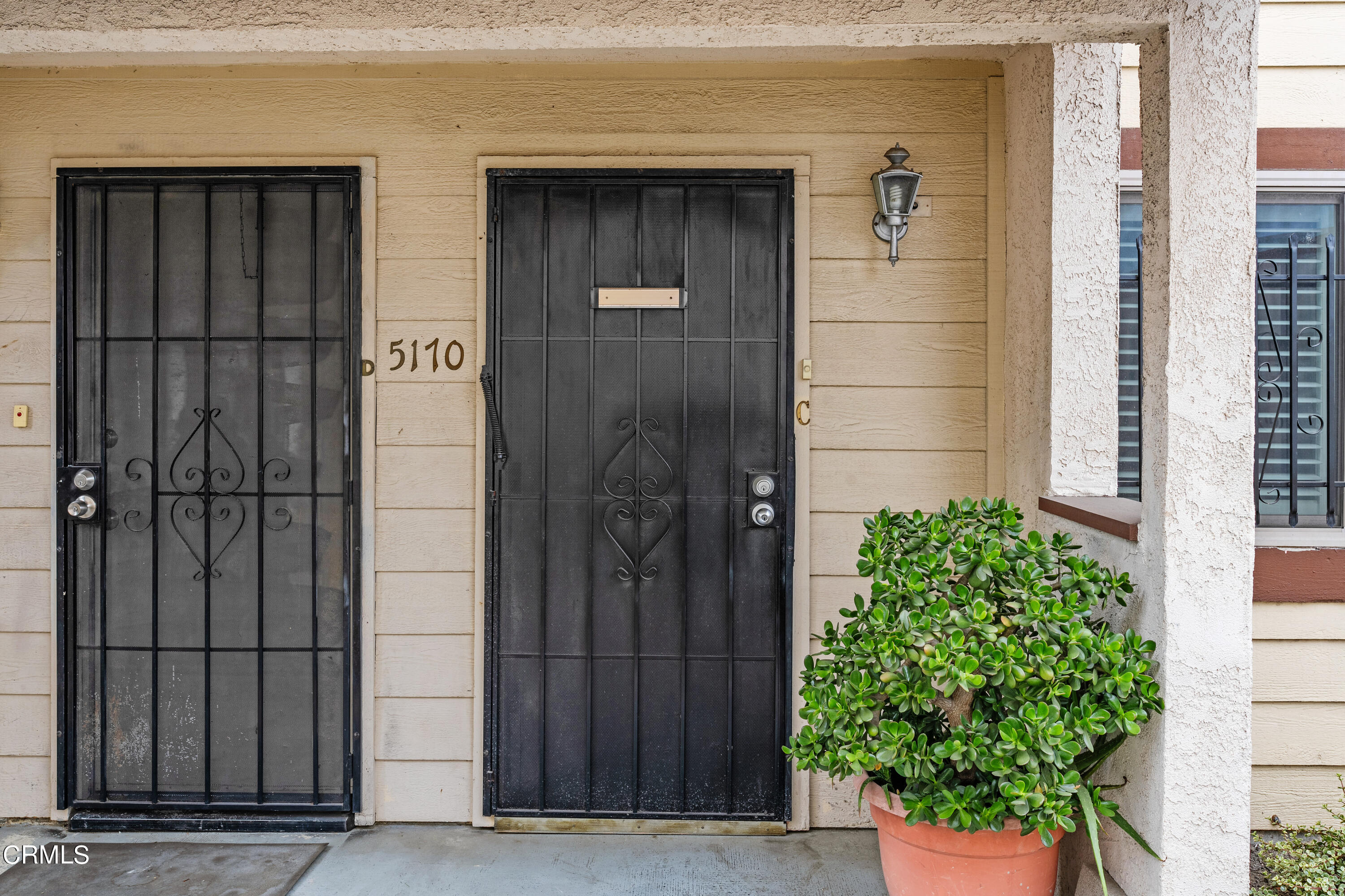 5170 North River Road, Unit C Oceanside, CA 92057 - Photo 4 of 43 a couple of potted plants in front of door