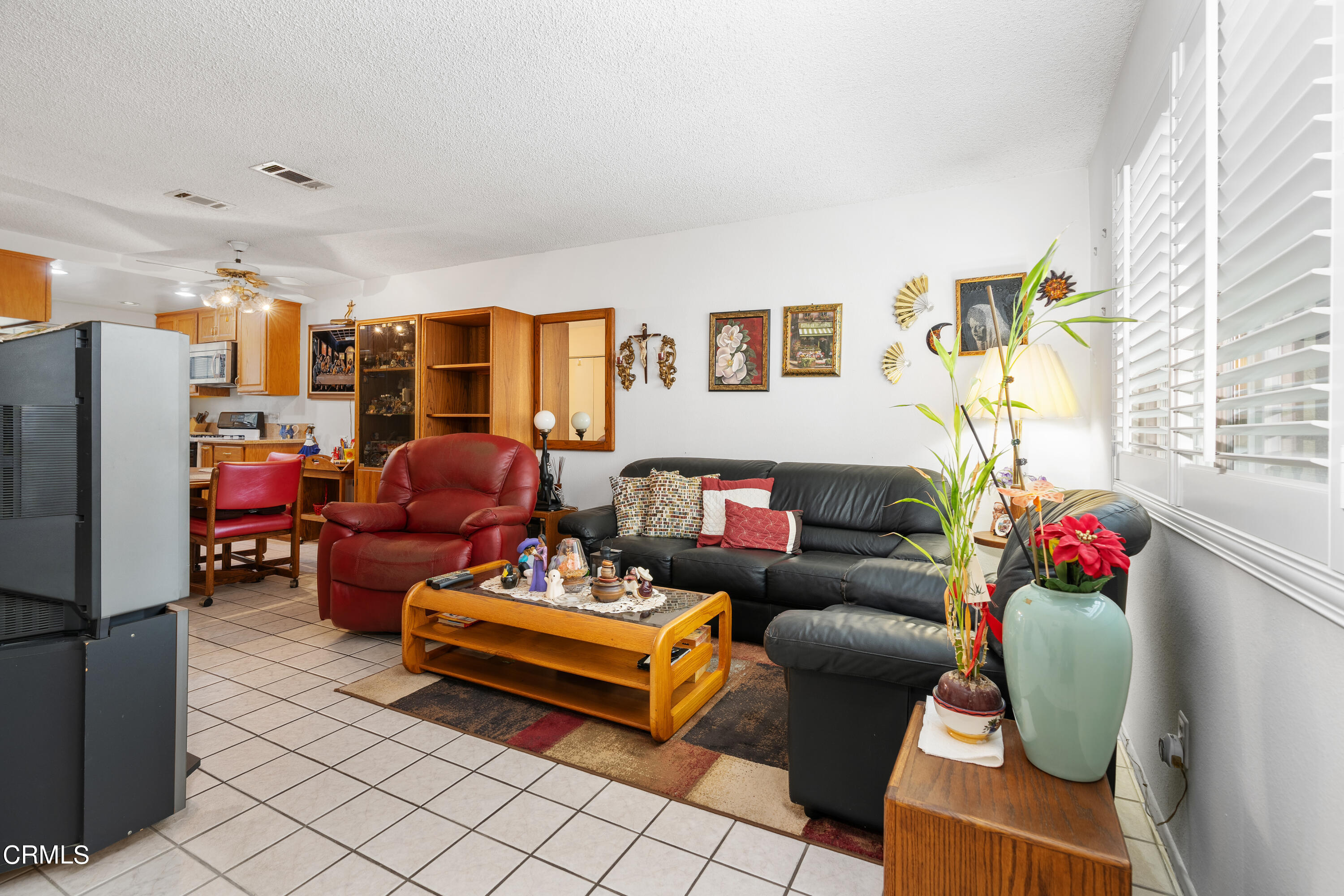 5170 North River Road, Unit C Oceanside, CA 92057 - Photo 6 of 43 a living room with furniture and a couch