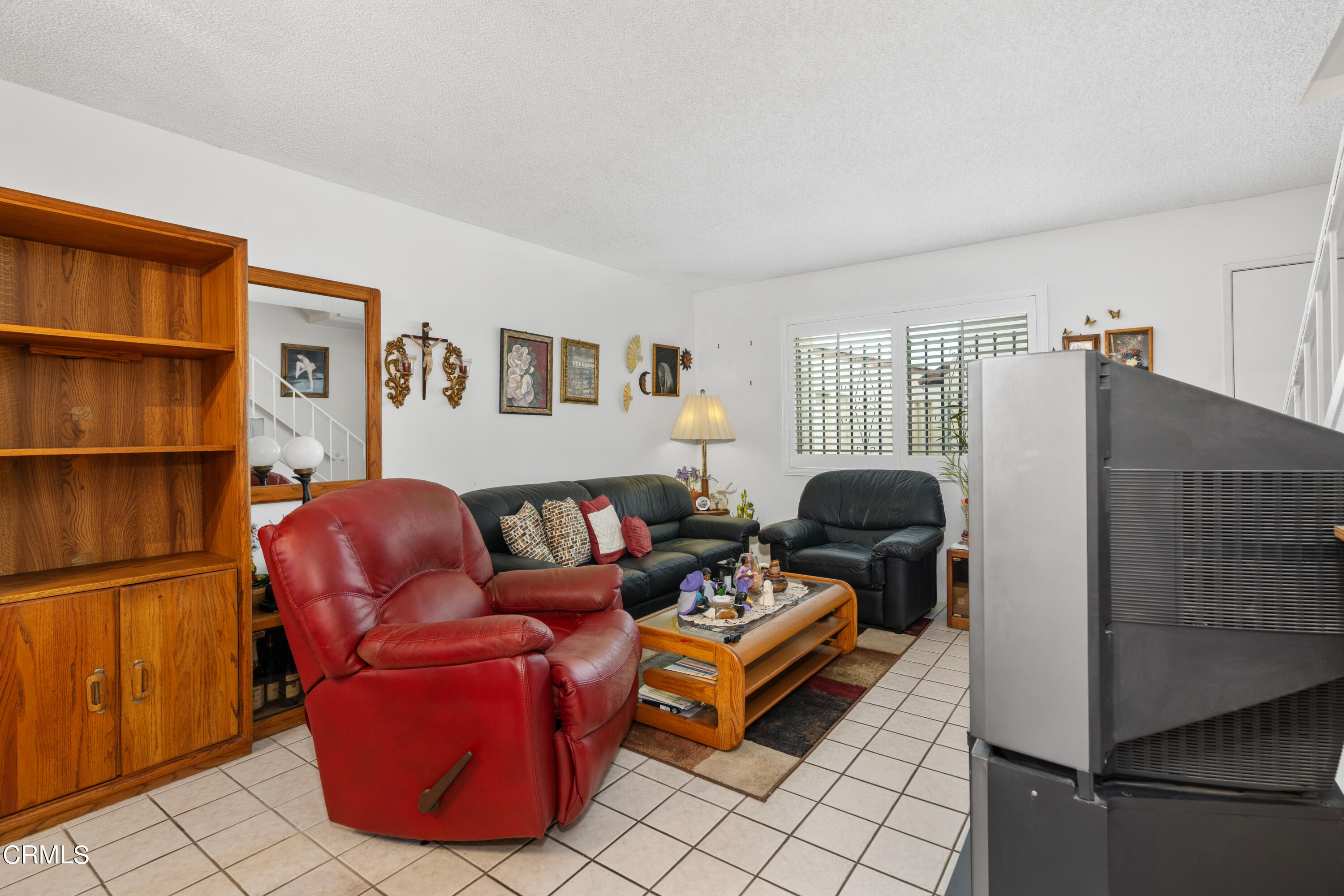 5170 North River Road, Unit C Oceanside, CA 92057 - Photo 10 of 43 a living room with furniture and a window