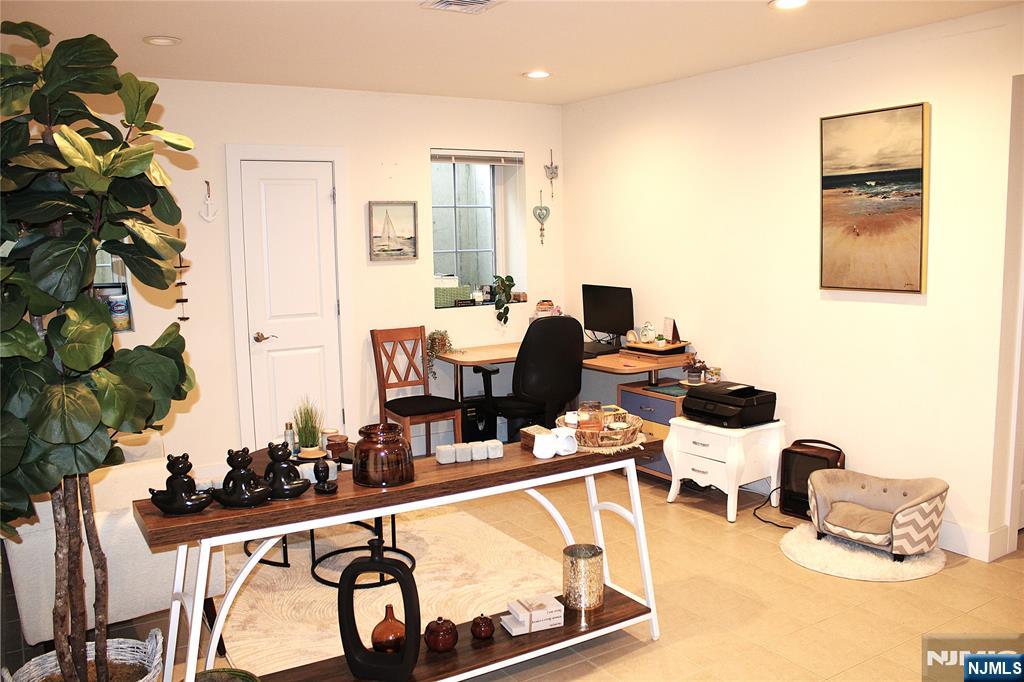 294-296 Tenafly Road Tenafly, NJ 07670 - Photo 9 of 24 a living room with furniture and a potted plant
