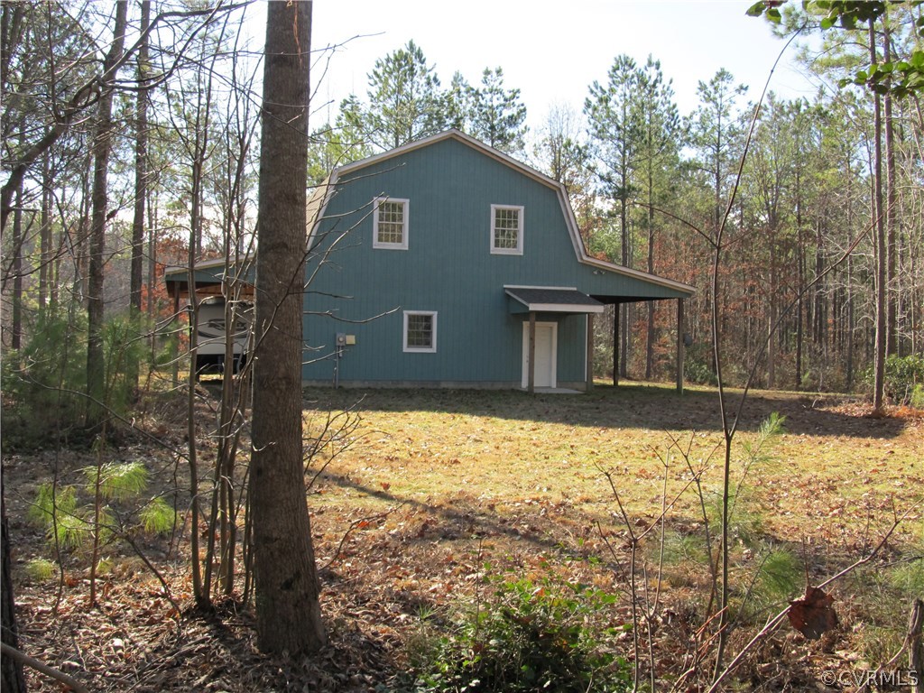 24663 King William Road West Point, VA 23181 - Photo 17 of 24 a front view of a house with a yard covered with snow