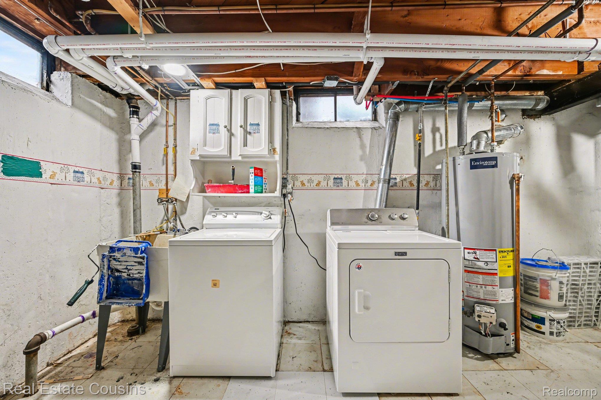 32224 Joy Road Livonia, MI 48150 - Photo 23 of 33 Laundry area with gas water heater, washing machine and clothes dryer, and concrete flooring