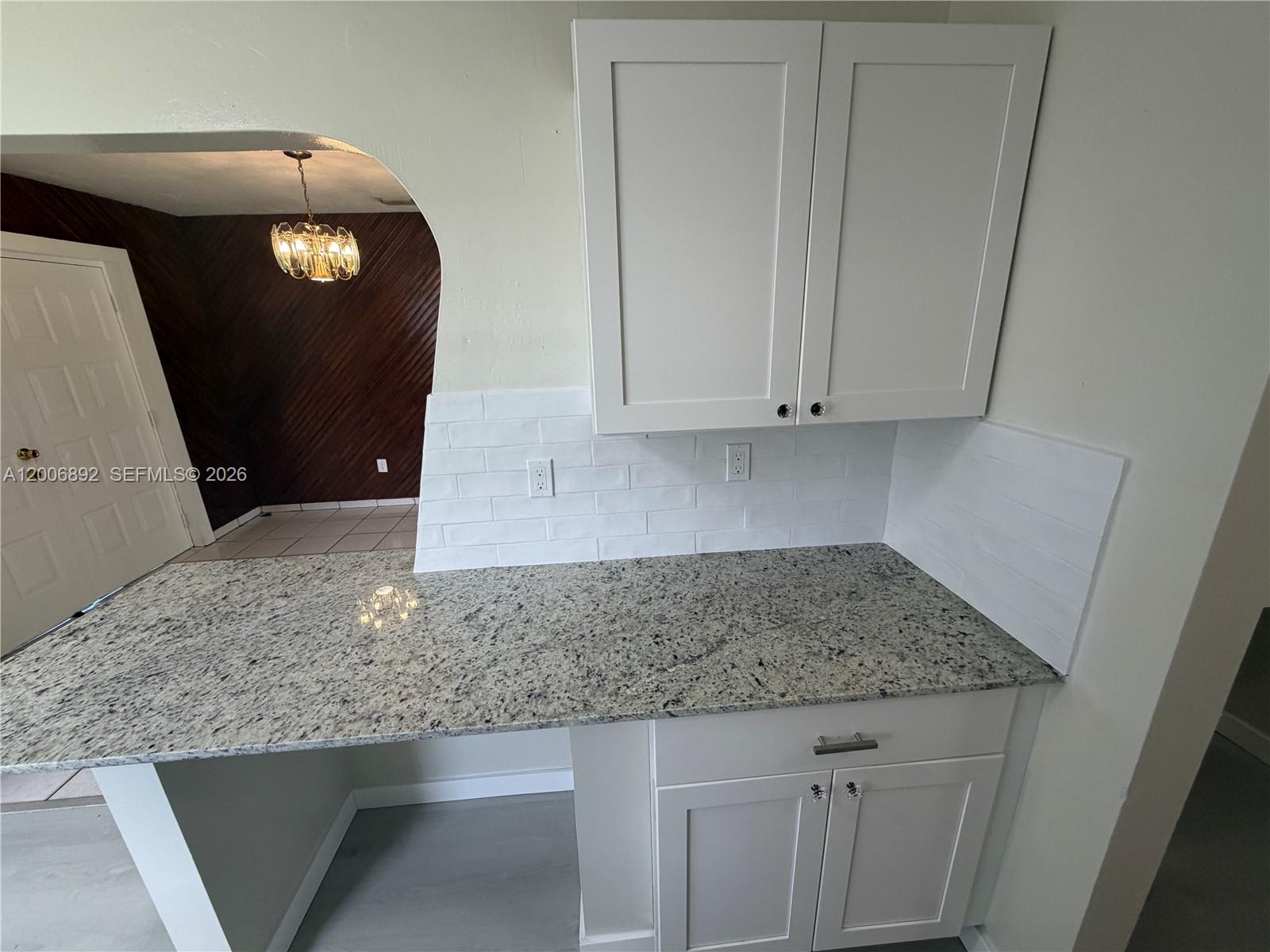 10375 Southwest 152nd Terrace Miami, FL 33157 - Photo 16 of 59 a kitchen with granite countertop cabinets and utility
