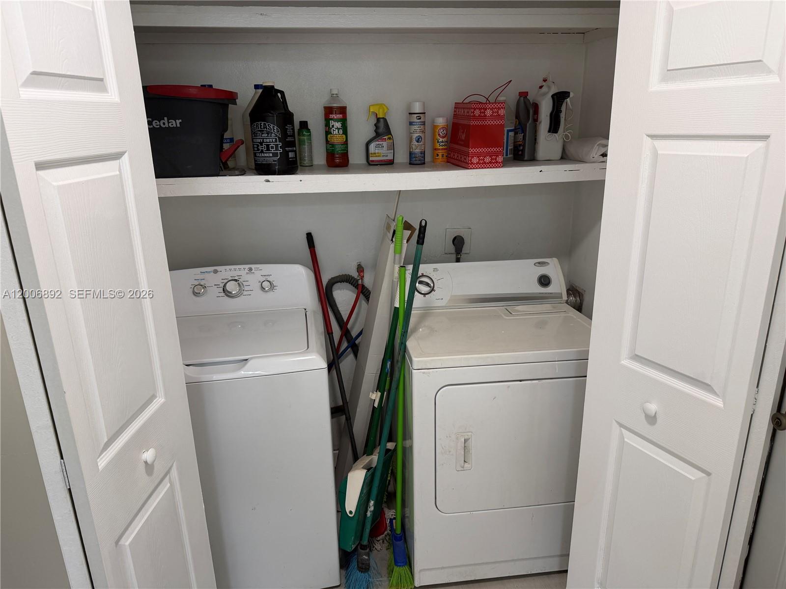 10375 Southwest 152nd Terrace Miami, FL 33157 - Photo 18 of 59 a view of storage and utility room with washer and dryer