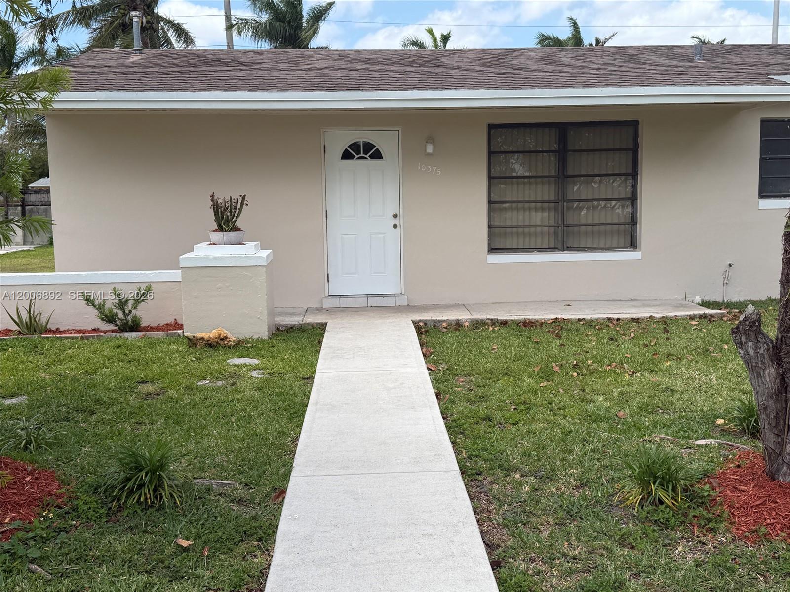 10375 Southwest 152nd Terrace Miami, FL 33157 - Photo 2 of 59 a front view of a house