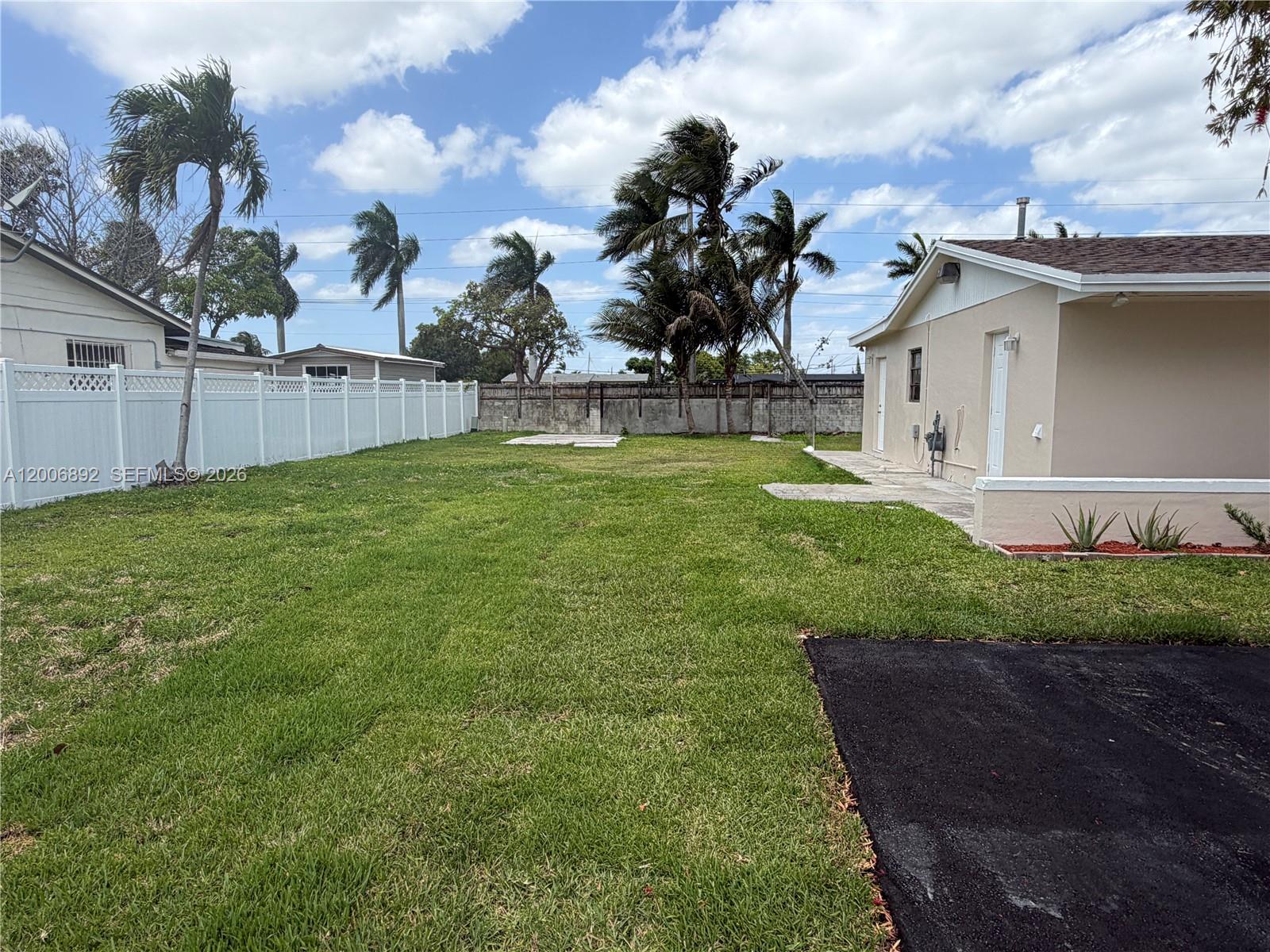 10375 Southwest 152nd Terrace Miami, FL 33157 - Photo 4 of 59 a view of a house with backyard and garden