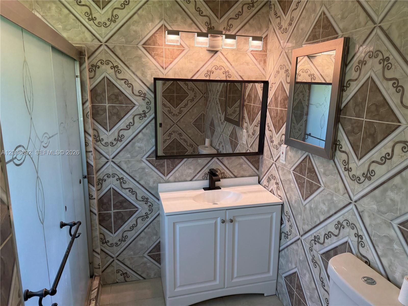 10375 Southwest 152nd Terrace Miami, FL 33157 - Photo 55 of 59 a utility room with a sink dryer and washer