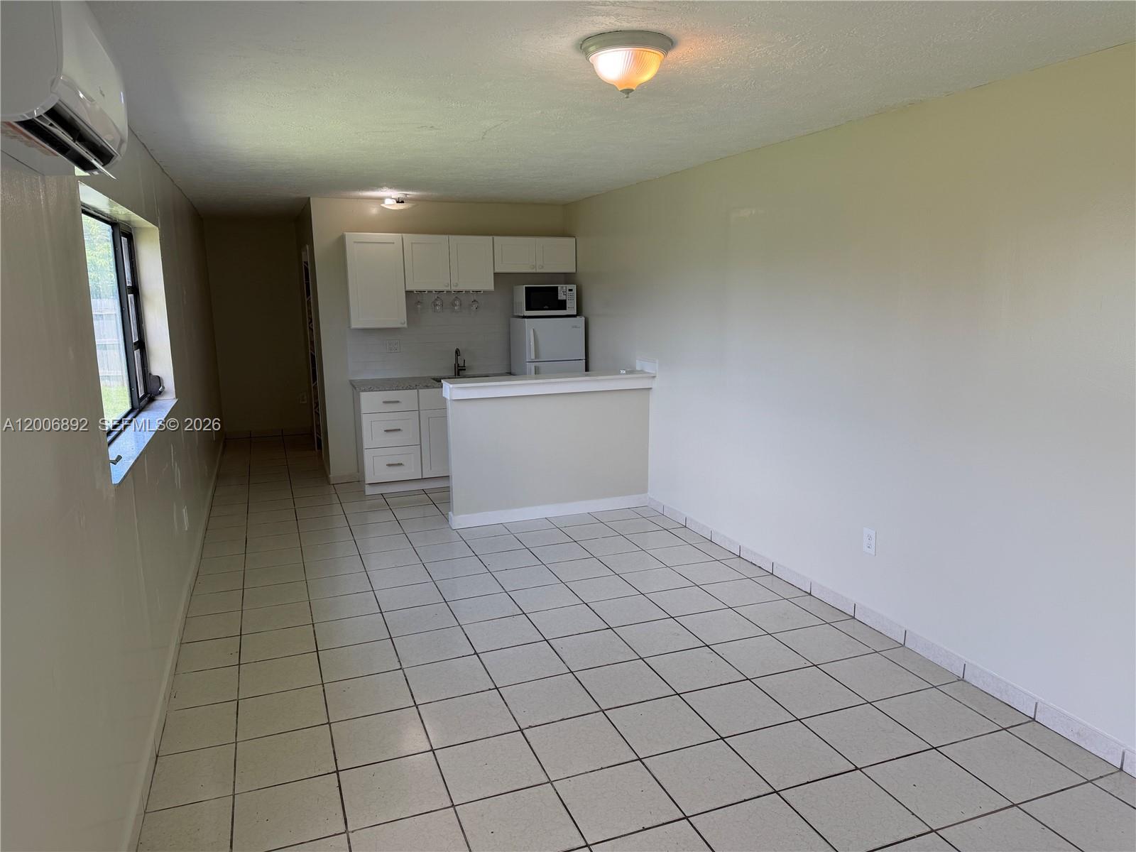 10375 Southwest 152nd Terrace Miami, FL 33157 - Photo 57 of 59 a view of a kitchen with white cabinets