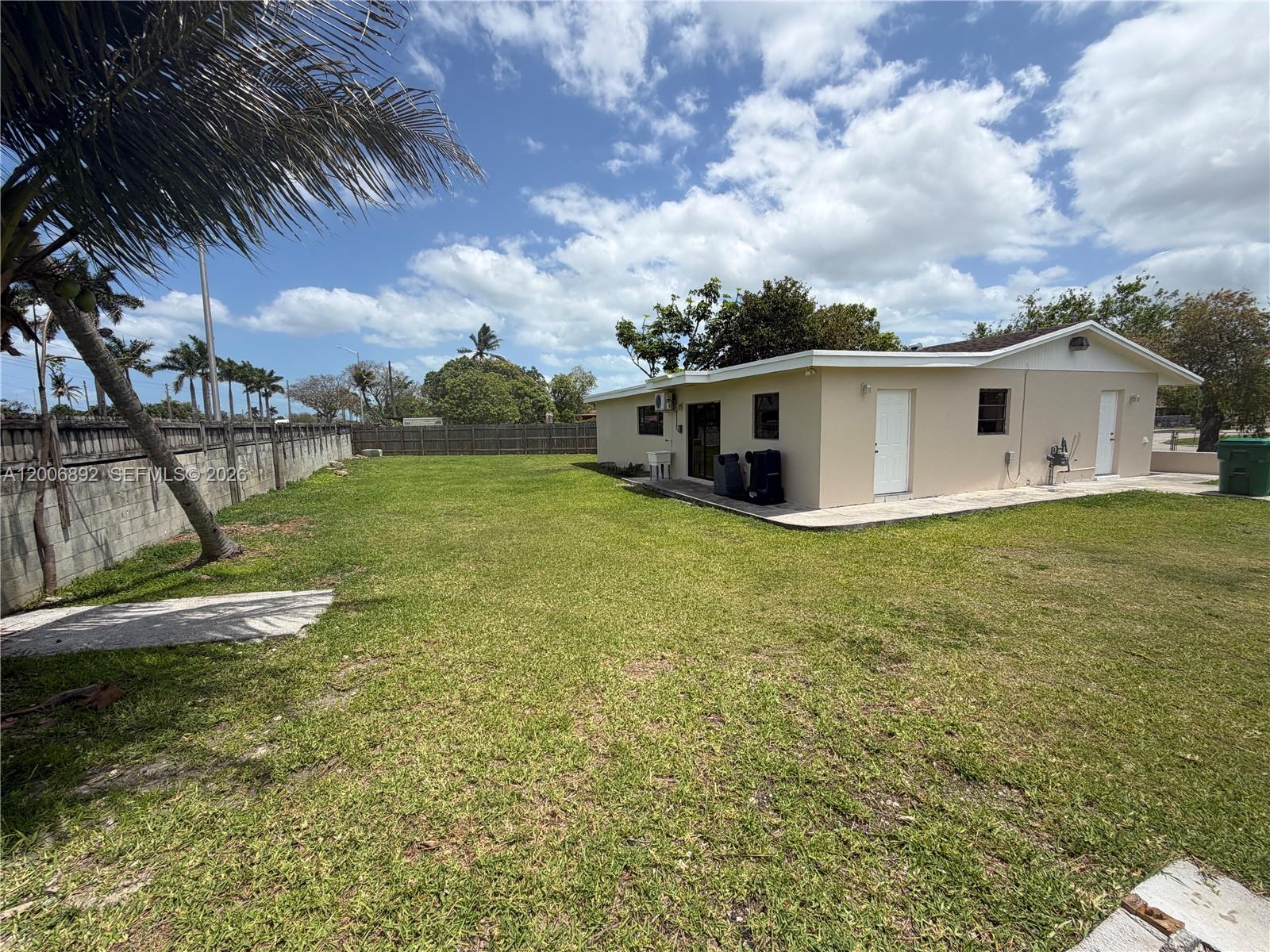 10375 Southwest 152nd Terrace Miami, FL 33157 - Photo 59 of 59 a view of a house with a yard