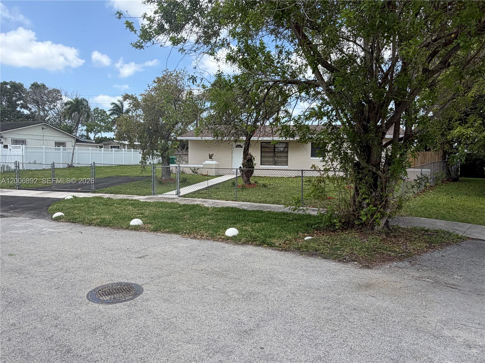 10375 Southwest 152nd Terrace Miami, FL 33157 - Photo 7 of 59 a view of a house with backyard and trees
