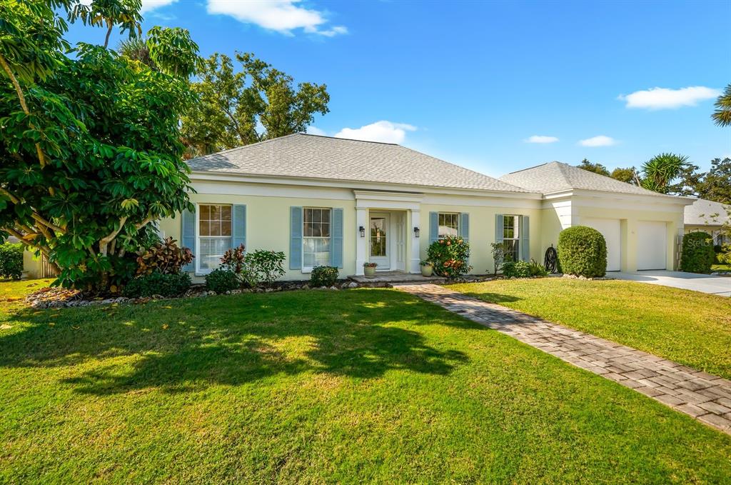 5 Barbados Road, Unit 31 Englewood, FL 34223 - Photo 1 of 40 a view of a house with a backyard and a patio