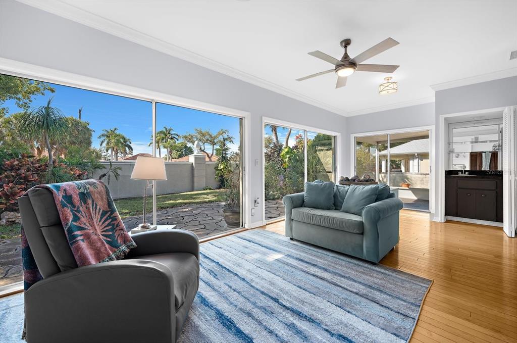 5 Barbados Road, Unit 31 Englewood, FL 34223 - Photo 13 of 40 a living room with furniture and a floor to ceiling window