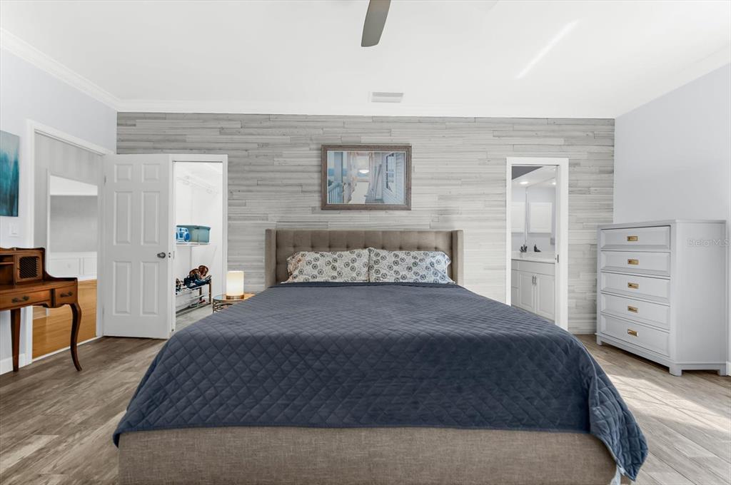 5 Barbados Road, Unit 31 Englewood, FL 34223 - Photo 16 of 40 a bedroom with a large bed and a couch