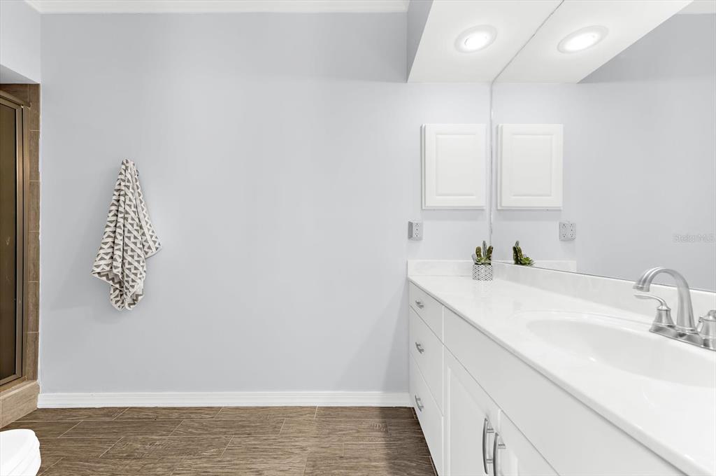 5 Barbados Road, Unit 31 Englewood, FL 34223 - Photo 18 of 40 a bathroom with a sink and a mirror