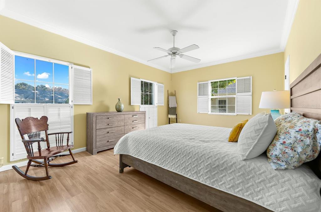 5 Barbados Road, Unit 31 Englewood, FL 34223 - Photo 21 of 40 a bedroom with a bed a table and chair