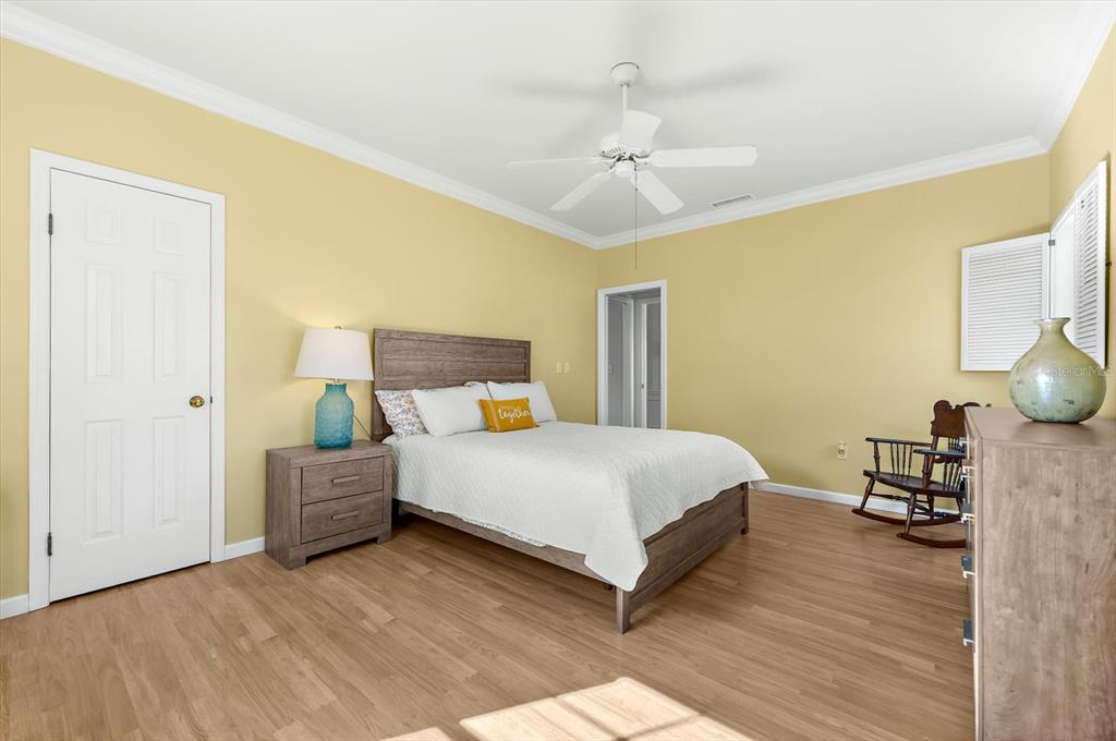 5 Barbados Road, Unit 31 Englewood, FL 34223 - Photo 22 of 40 a bedroom with a bed and wooden floor