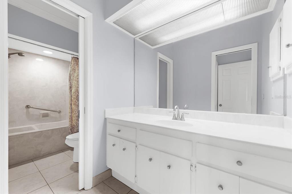 5 Barbados Road, Unit 31 Englewood, FL 34223 - Photo 24 of 40 a bathroom with a sink a toilet and a tub