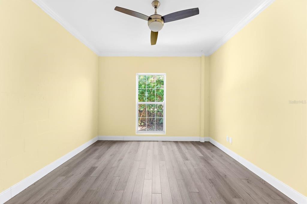 5 Barbados Road, Unit 31 Englewood, FL 34223 - Photo 26 of 40 a view of a room with wooden floor staircase and a ceiling fan