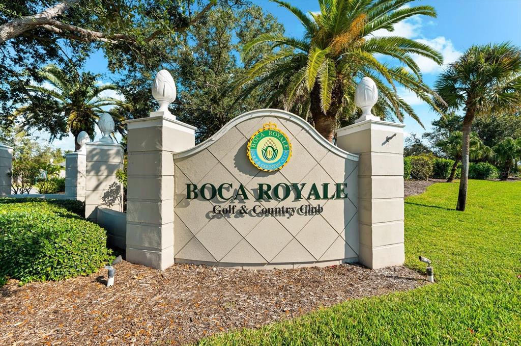 5 Barbados Road, Unit 31 Englewood, FL 34223 - Photo 32 of 40 a sign that is on a brick wall