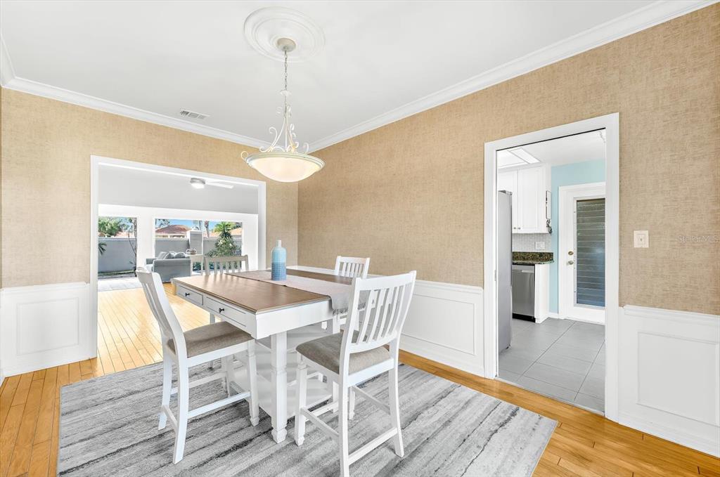 5 Barbados Road, Unit 31 Englewood, FL 34223 - Photo 5 of 40 a view of a dining room with furniture window and wooden floor