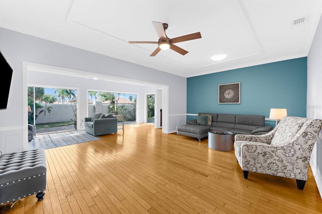 5 Barbados Road, Unit 31 Englewood, FL 34223 - Photo 8 of 40 a living room with fireplace furniture and a wooden floor