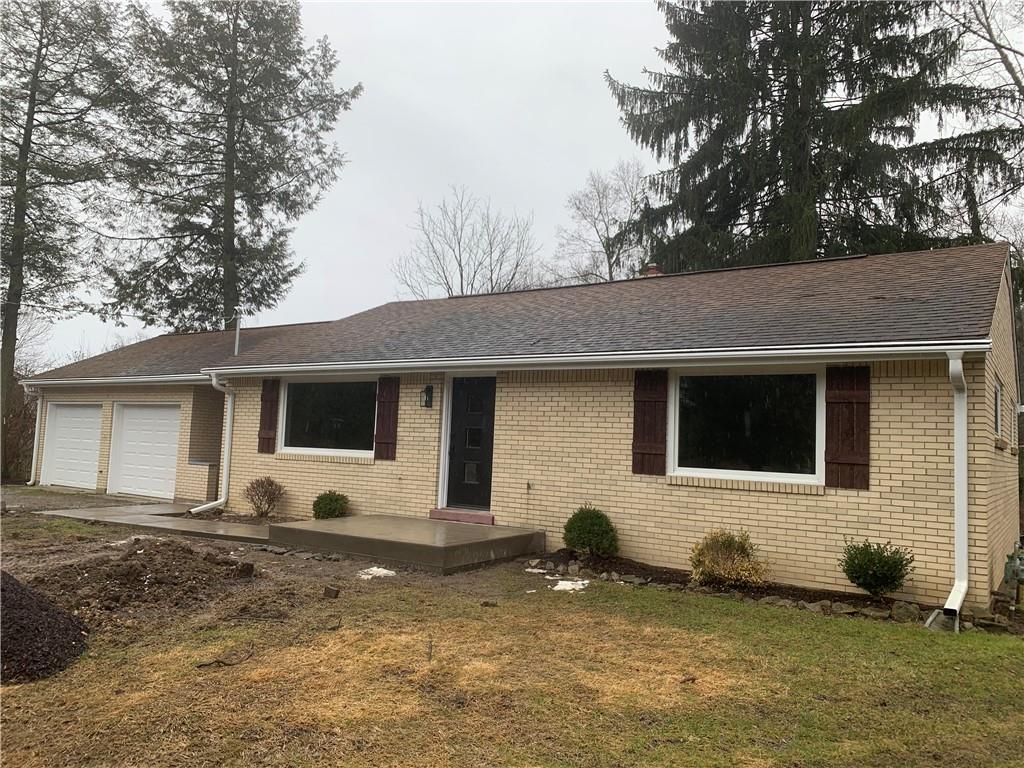 604 New Texas Road Pittsburgh, PA 15239 - Photo 1 of 18 a backyard of a house with table and chairs