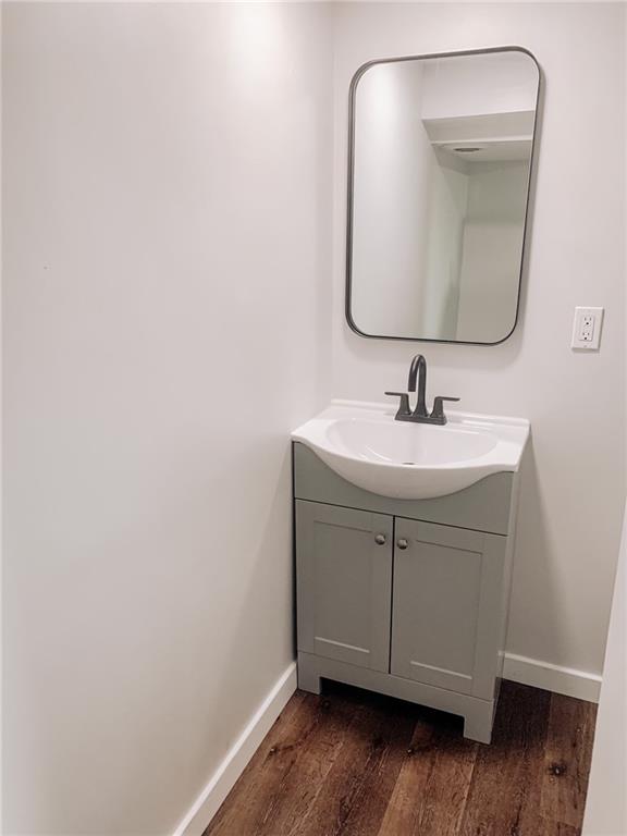604 New Texas Road Pittsburgh, PA 15239 - Photo 13 of 18 a bathroom with a sink and a mirror