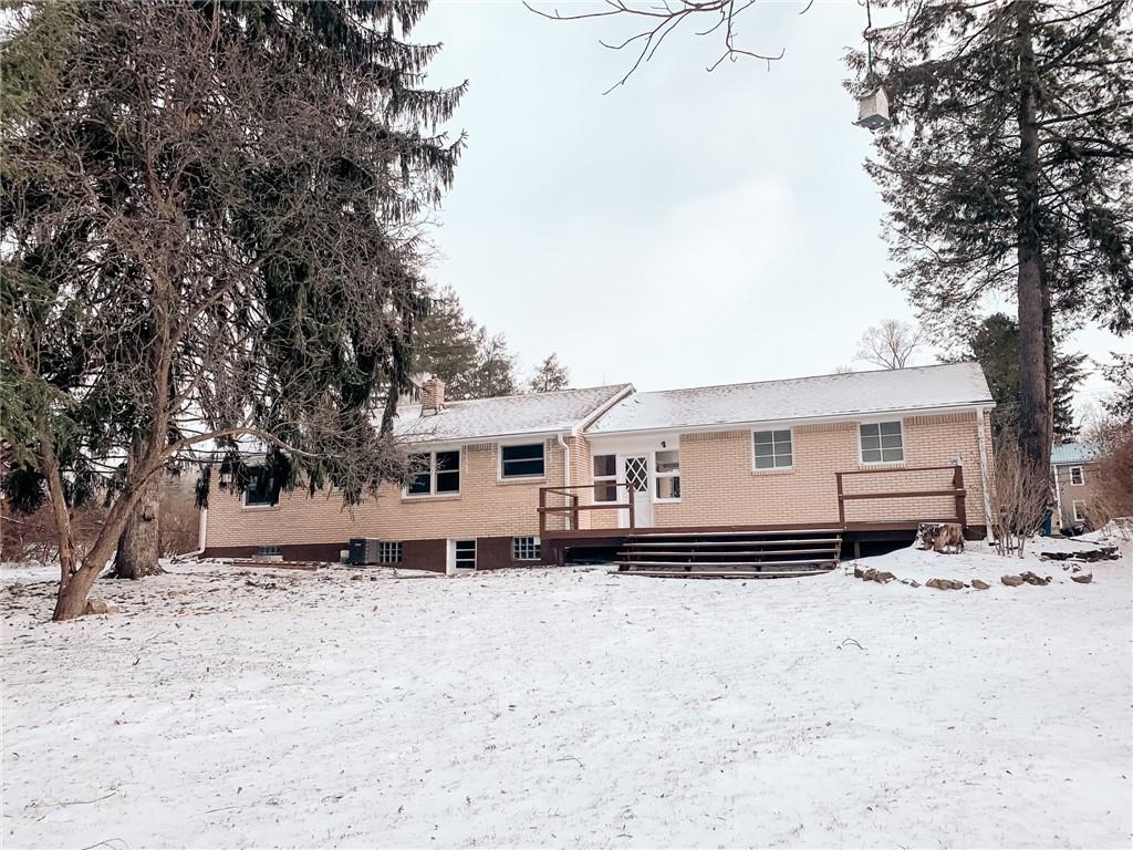 604 New Texas Road Pittsburgh, PA 15239 - Photo 18 of 18 a white house that has a tree in front of it