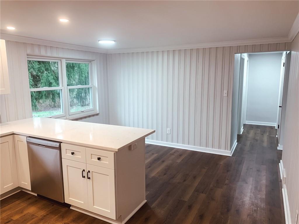 604 New Texas Road Pittsburgh, PA 15239 - Photo 4 of 18 an empty room with wooden floor and windows