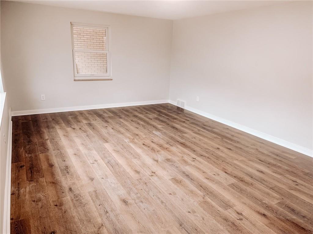 604 New Texas Road Pittsburgh, PA 15239 - Photo 5 of 18 a view of empty room with wooden floor
