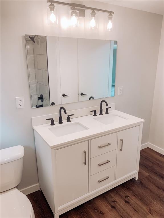 604 New Texas Road Pittsburgh, PA 15239 - Photo 10 of 18 a bathroom with a double vanity sink and a mirror
