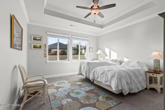 a bathroom with a tub a sink and a large mirror