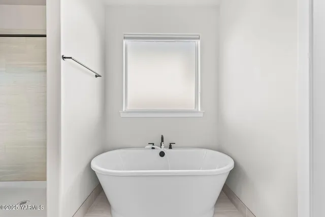 a view of a workspace with furniture and a bedroom