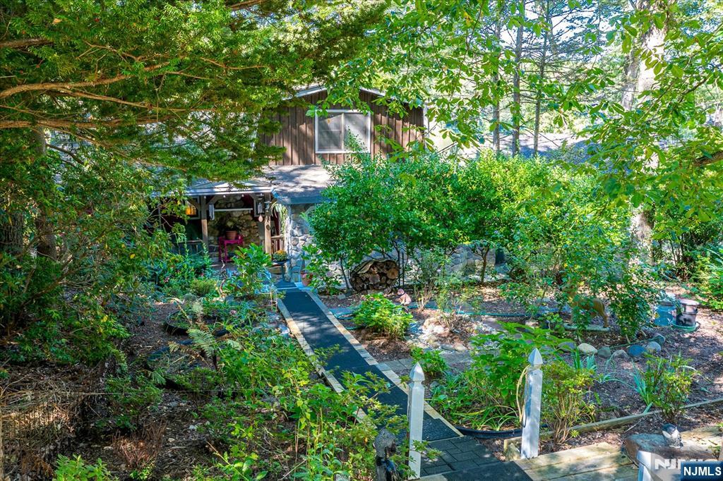 177 Otterhole Road West Milford, NJ 07480 - Photo 1 of 49 a backyard of a house with lots of green space and fountain