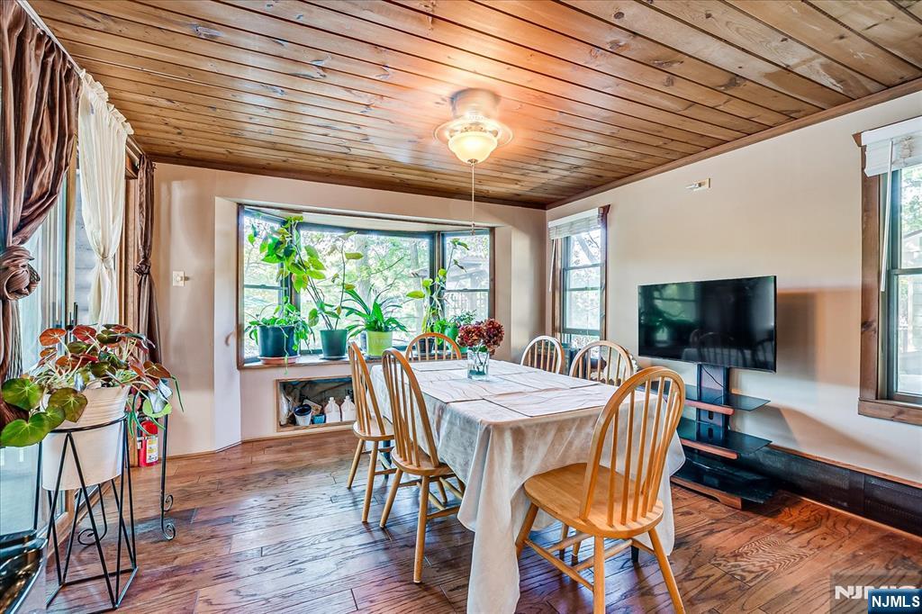 177 Otterhole Road West Milford, NJ 07480 - Photo 17 of 49 a view of a dining room with furniture window and wooden floor
