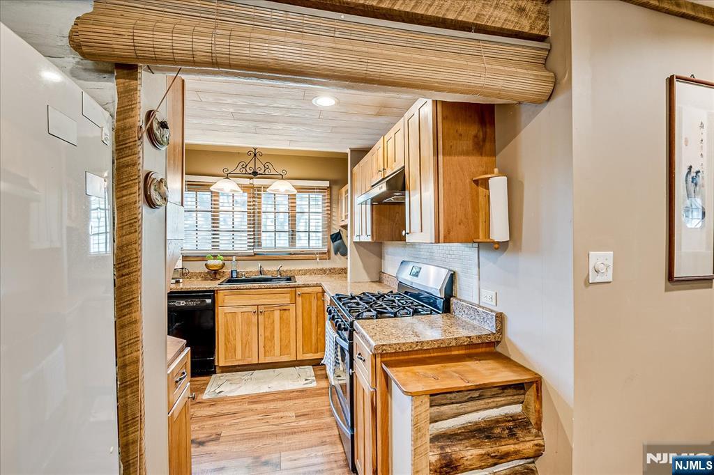 177 Otterhole Road West Milford, NJ 07480 - Photo 23 of 49 a kitchen with a stove a sink and a refrigerator