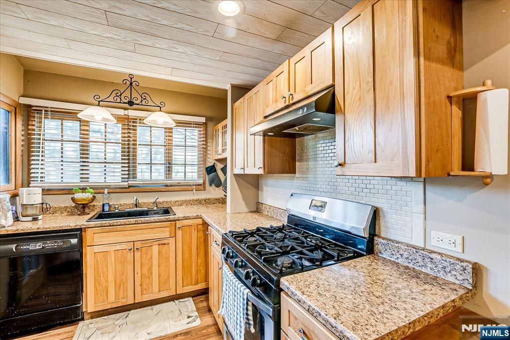 177 Otterhole Road West Milford, NJ 07480 - Photo 24 of 49 a kitchen with stainless steel appliances granite countertop a stove a sink and a microwave