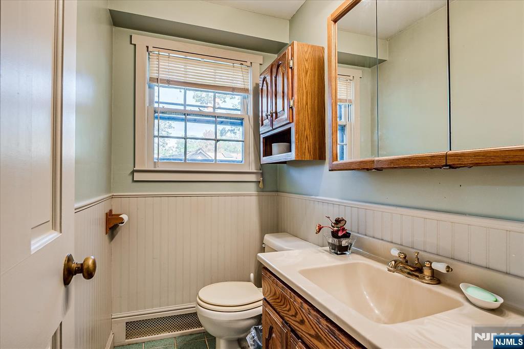 177 Otterhole Road West Milford, NJ 07480 - Photo 34 of 49 a bathroom with a sink toilet and a mirror