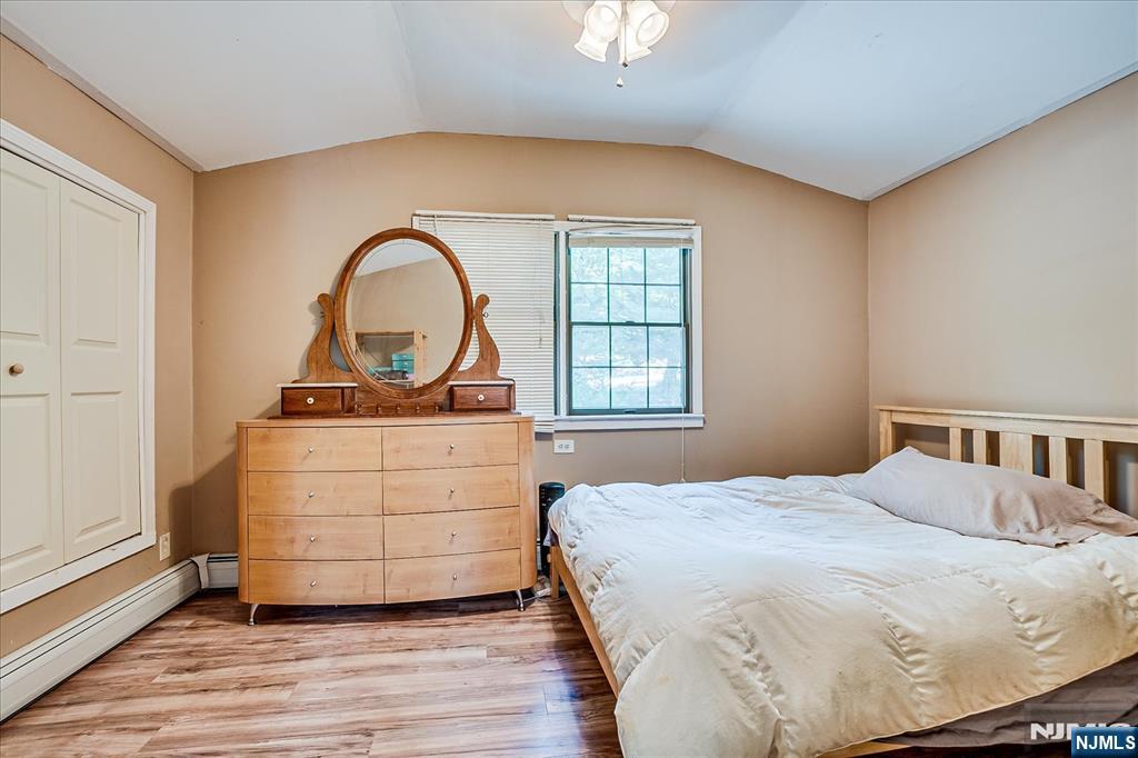 177 Otterhole Road West Milford, NJ 07480 - Photo 35 of 49 a bedroom with a bed and a dresser next to a window