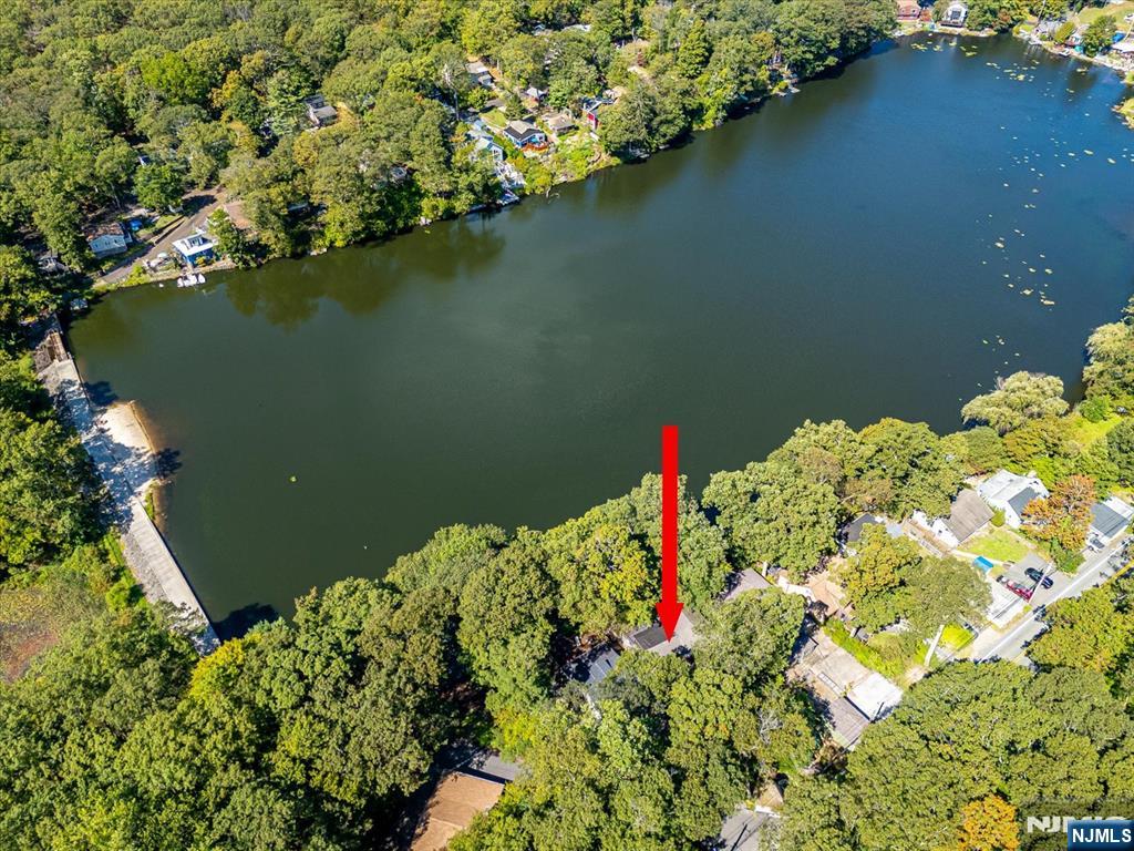177 Otterhole Road West Milford, NJ 07480 - Photo 4 of 49 a view of a lake with a flower garden